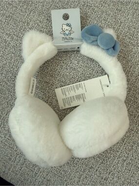 Hello Kitty White Faux Fur Earmuffs with Light Blue Bow Accent